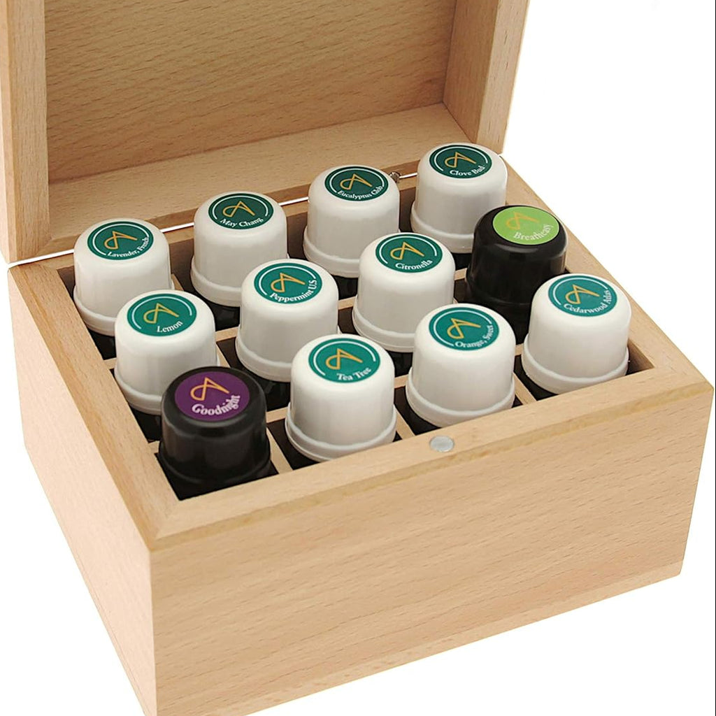 Set of small bottles with colored caps in a wooden box